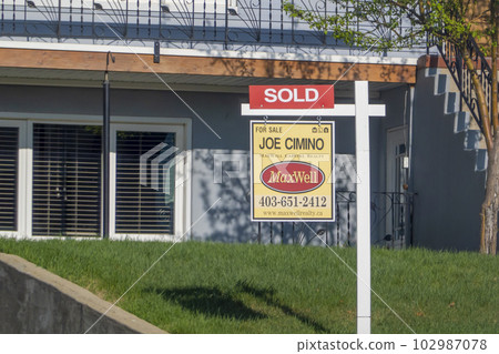 Calgary, Alberta, Canada. May 12, 2023. A real state Maxwell sold property for sale sign. Concept 102987078