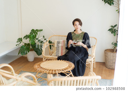 Photo of a woman drinking tea 102988508