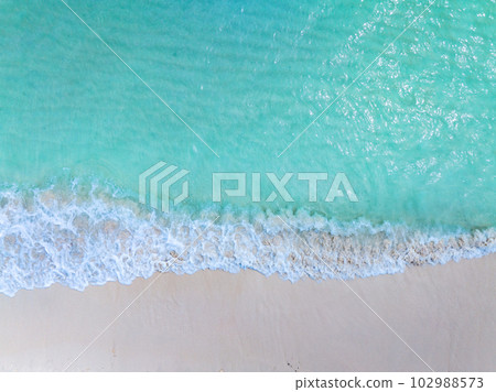 Top view Colorful Beach waves sea surface seashore, Amazing waves crashing on sandy shore,Beautiful sand beach,Nature and travel background 102988573