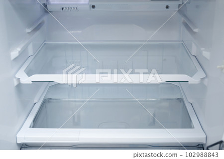 Interior view of the shelf of the refrigerator at home Interior view of the shelf of the refrigerator at home 102988843