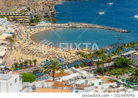 Puerto de Mogan town on the coast of Gran Canaria island, Spain. Puerto de Mogan town on the coast of Gran Canaria island, Spain. 102989048