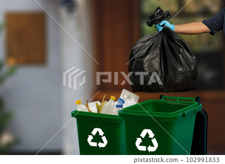 person hand holding garbage bag bag in to trash dump food environment city green background bio recycling eco responsible concept person hand holding garbage bag bag in to trash dump food environment city green background bio recycling eco responsible concept 102991833