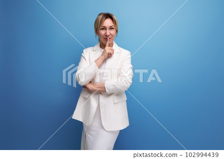 well-groomed confident young caucasian blond lady in an elegant look well-groomed confident young caucasian blond lady in an elegant look 102994439