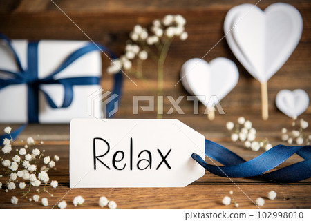Label With White Heart Decoration, Flower, Gift, Text Relax 102998010