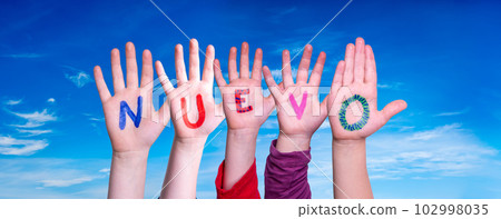 Children Hands Building Word Nuevo, Blue Sky 102998035