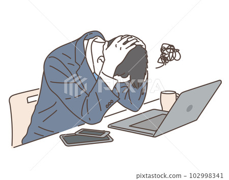 A businessman holding a head in front of a personal computer A businessman holding a head in front of a personal computer 102998341