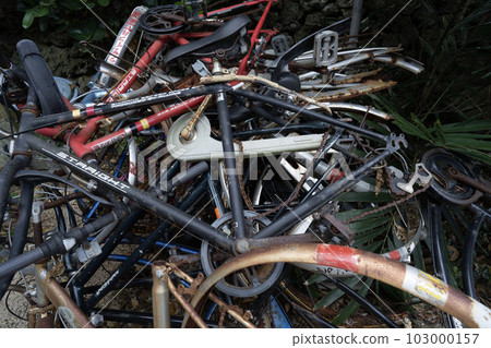 Illegally dumped discarded bicycles, illegally dumped scrapped bicycles, illegally parked bicycles in garbage 103000157