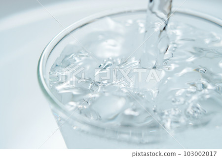 water poured in glass 103002017