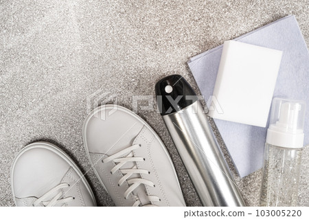 White leather shoe cleaning kit - water-repellent spray, foam, rag and sponge, copy space, place for text White leather shoe cleaning kit - water-repellent spray, foam, rag and sponge, copy space, place for text 103005220