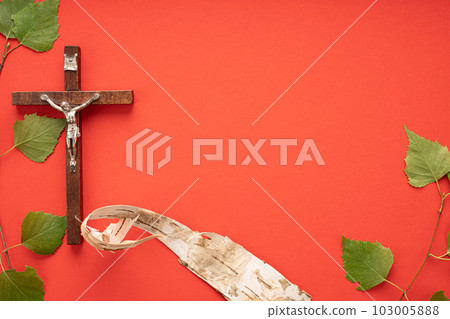 Christian Pentecost. Whit Sunday. A cross with a birch branch on a white, green, red and black background. 103005888