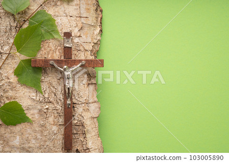 Christian Pentecost. Whit Sunday. A cross with a birch branch on a white, green, red and black background. 103005890