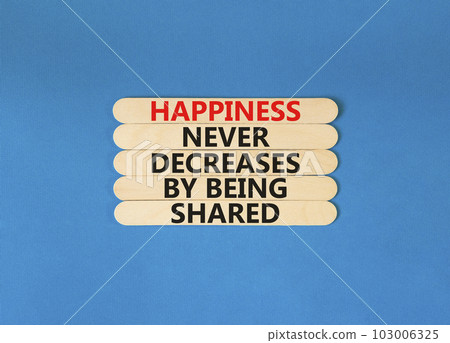 Happiness symbol. Concept words Happiness never decreases by being shared on wooden stick. Beautiful blue table blue background. Motivational Happiness concept. Copy space. Happiness symbol. Concept words Happiness never decreases by being shared on wooden stick. Beautiful blue table blue background. Motivational Happiness concept. Copy space. 103006325