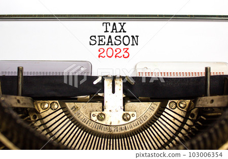Tax season 2023 symbol. Concept words Tax season 2023 typed on an old retro typewriter on a beautiful white paper background. Business Tax season 2023 concept. Copy space. Tax season 2023 symbol. Concept words Tax season 2023 typed on an old retro typewriter on a beautiful white paper background. Business Tax season 2023 concept. Copy space. 103006354