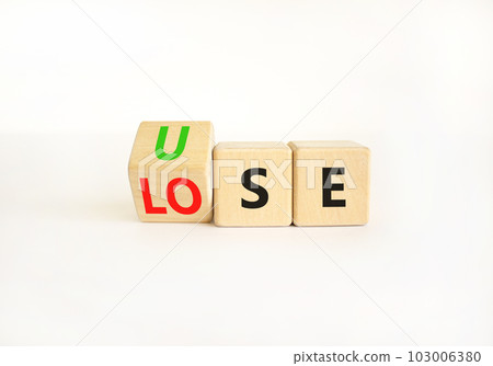 Use or lose symbol. Concept words Use or lose on wooden cubes. Businessman hand. Beautiful white table white background. Business Use or lose concept. Copy space. 103006380