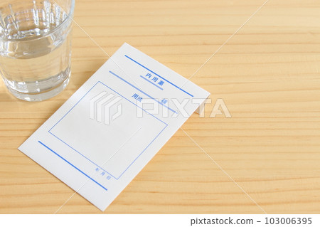 Medicine and water on the table [copy space natural] 103006395