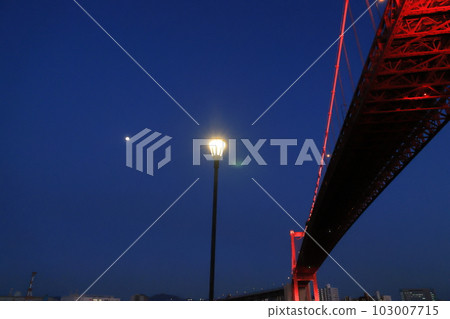 Illuminated street lights at dusk and Wakato Ohashi red suspension bridge 103007715