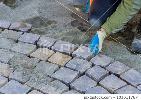 Use of granite stones for pavement created beautiful elegant look that was complemented by the use of industrial cobblestones. 103011767