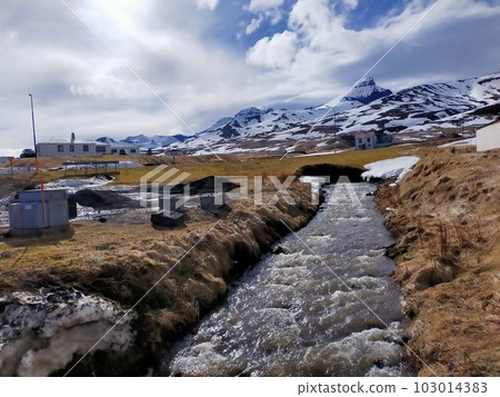 A stream flowing through a village in East Iceland A stream flowing through a village in East Iceland 103014383