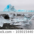 Blue Icebergs in Ocean Water. Glacier Ice Drift at Calm Water. Pure Ice Chunks from Melting Glacier. Icy Winter Landscape. Foggy Weather in Iceland. 103015440