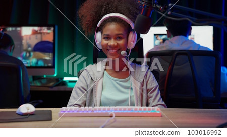 Game streamer using pc setup playing multiplayer first person shooter Game streamer using pc setup playing multiplayer first person shooter 103016992