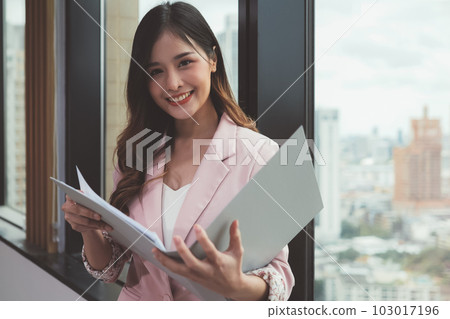 Portrait businesswoman in modern office among business officer people 103017196