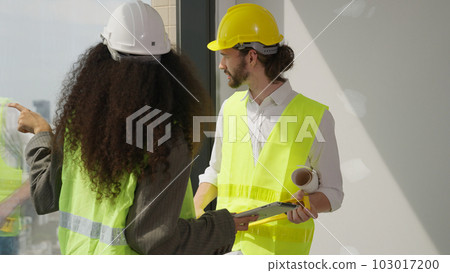 Couple of professional architects workers using tablet brainstorming 103017200