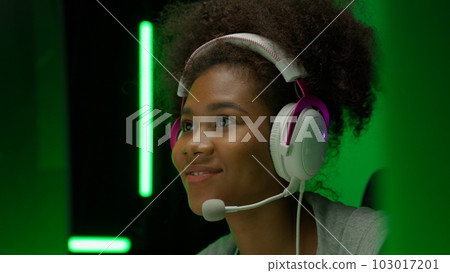 Game streamer using pc setup playing multiplayer first person shooter 103017201