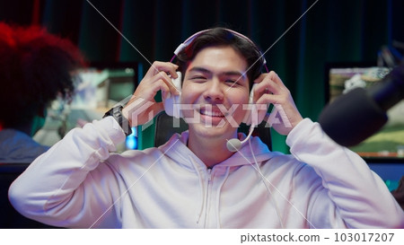 Game streamer using pc setup playing multiplayer first person shooter Game streamer using pc setup playing multiplayer first person shooter 103017207