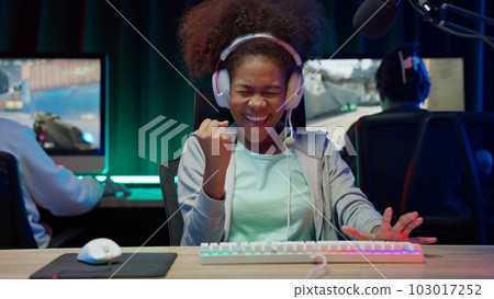 Game streamer using pc setup playing multiplayer first person shooter Game streamer using pc setup playing multiplayer first person shooter 103017252
