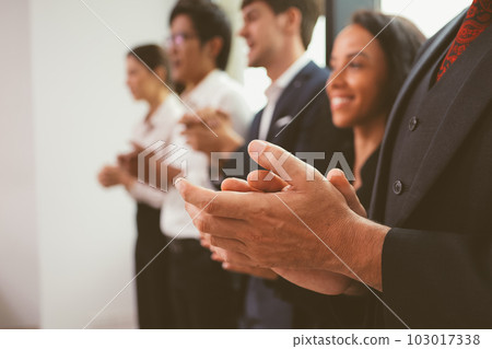 Happy business employees team celebrating success with praise in meeting room Happy business employees team celebrating success with praise in meeting room 103017338