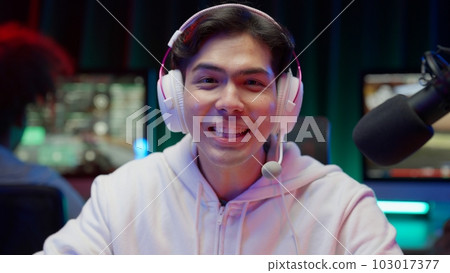Game streamer using pc setup playing multiplayer first person shooter Game streamer using pc setup playing multiplayer first person shooter 103017377