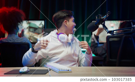 Game streamer using pc setup playing multiplayer first person shooter Game streamer using pc setup playing multiplayer first person shooter 103017385