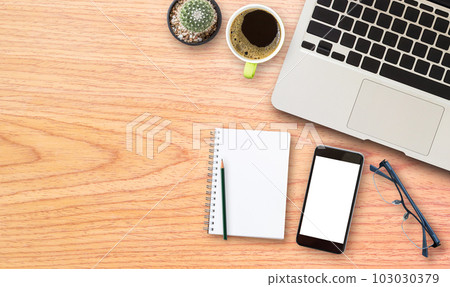 laptop comuter with cup of coffee on wooden desk laptop comuter with cup of coffee on wooden desk 103030379