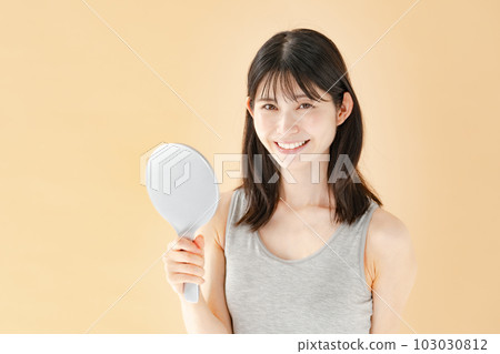 Woman checking with a hand mirror beauty 103030812