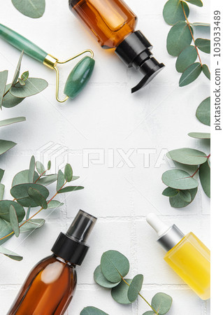 Spa treatment concept. natural spa cosmetics products with eucalyptus oil, massage jade roller Spa treatment concept. natural spa cosmetics products with eucalyptus oil, massage jade roller 103033489
