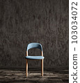 Blue fabric dining chair against dark stucco wall. 3d rendering 103034072