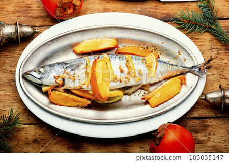 Mackerel fish baked with fruits. 103035147