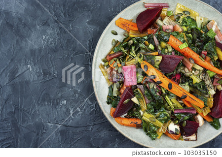 Stewed vegetables and chard leaves, copy space. 103035150