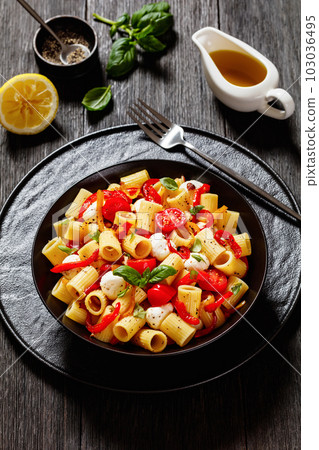pepper tomato mozzarella pasta salad in bowl 103036495