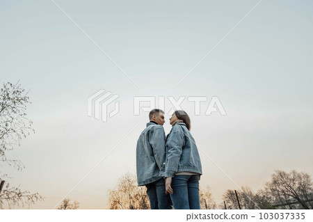 stunning sensual young couple in love posing at the sunset, happy lifestyle concept stunning sensual young couple in love posing at the sunset, happy lifestyle concept 103037335
