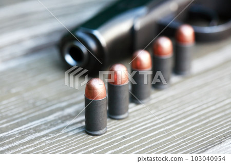 Bullets Near Handgun Bullets Near Handgun 103040954