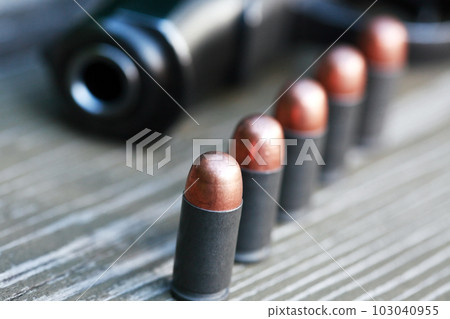 Bullets Near Handgun Bullets Near Handgun 103040955