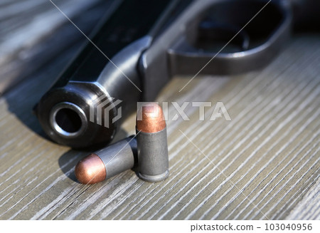 Bullets Near Handgun Bullets Near Handgun 103040956