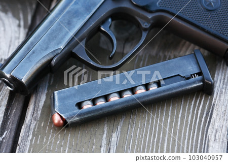 Bullets Near Handgun Bullets Near Handgun 103040957