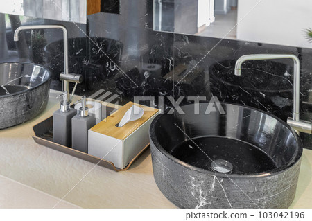bathroom with black marble sink and marble wall bathroom with black marble sink and marble wall 103042196