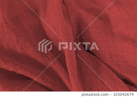 close-up of red colorful fabric surfaces. close-up of red colorful fabric surfaces. 103042674