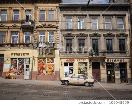 [Ukraine] A rusty car parked in a retro building in the old town of Lviv 103048909