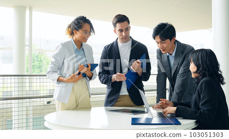 Multinational business group talking in lobby Multinational business group talking in lobby 103051303