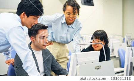 Multinational group having a conversation in the office 103051318