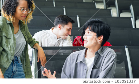 Group of multinational students having a conversation in a classroom 103051337
